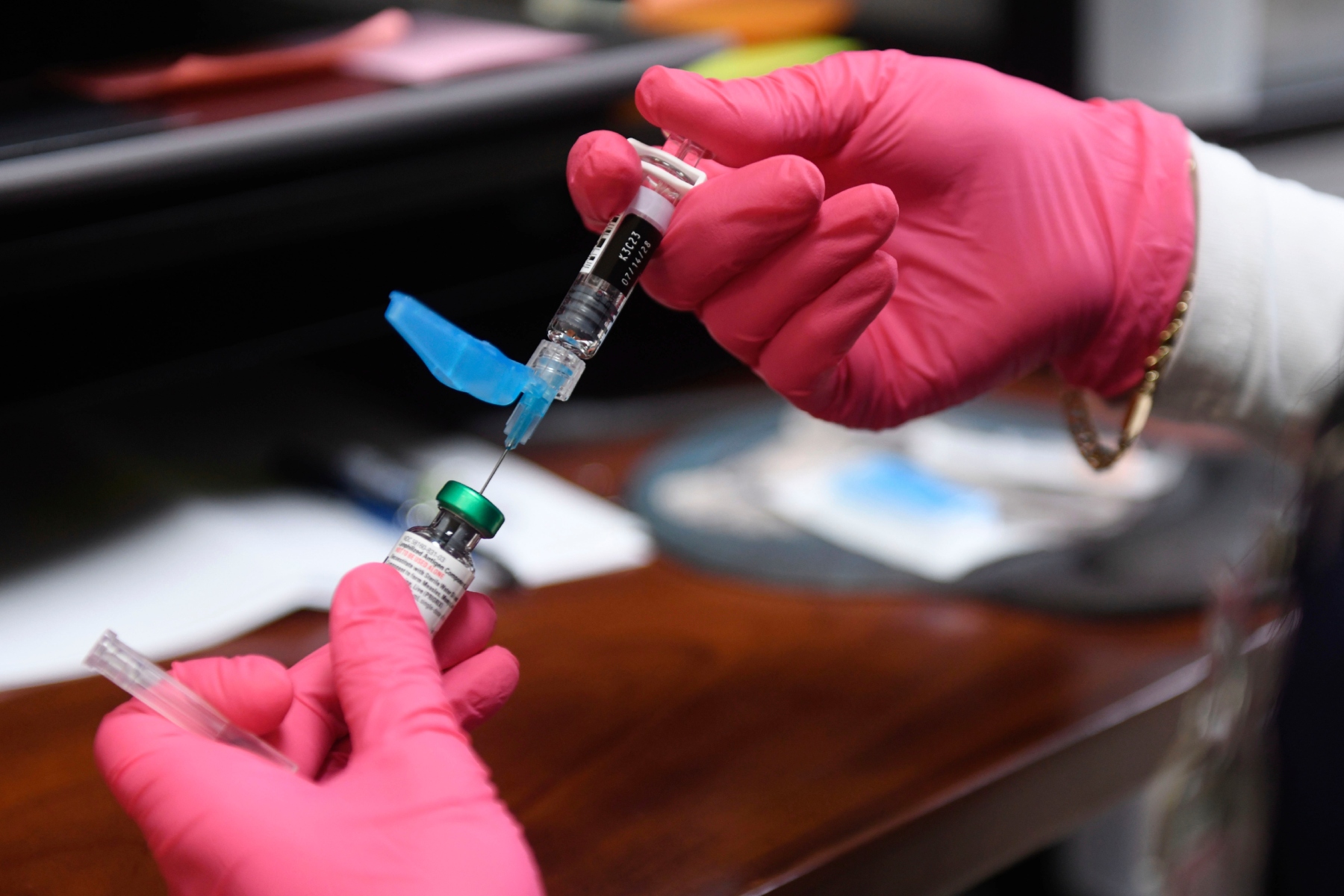 FILE - Anna Hicks prepares a measles, mumps and rubella vaccine at the Andrews County Health Department, Tuesday, April 8, 2025, in Andrews, Texas. (AP Photo/Annie Rice, File)