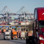 FILE- Tractor-trailers move cargo out of the Port of Savannah in Savannah, Ga., Jan. 30, 2018. (AP Photo/Stephen B. Morton, File)