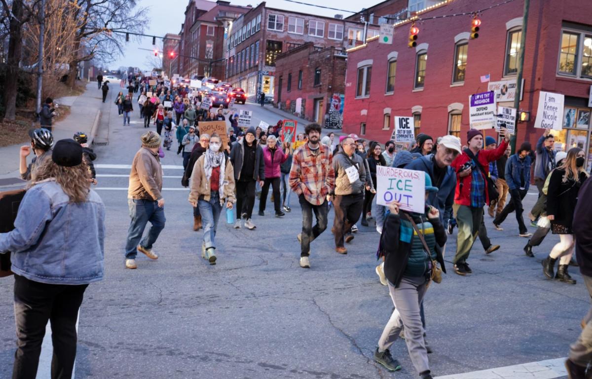 Protesters march through downtown Asheville, N.C., on Wednesday, Jan. 8, during a demonstration opposing U.S. Immigration and Customs Enforcement (ICE), following reports of a fatal shooting involving an ICE agent in Minneapolis. (Photo credit: James Burns)