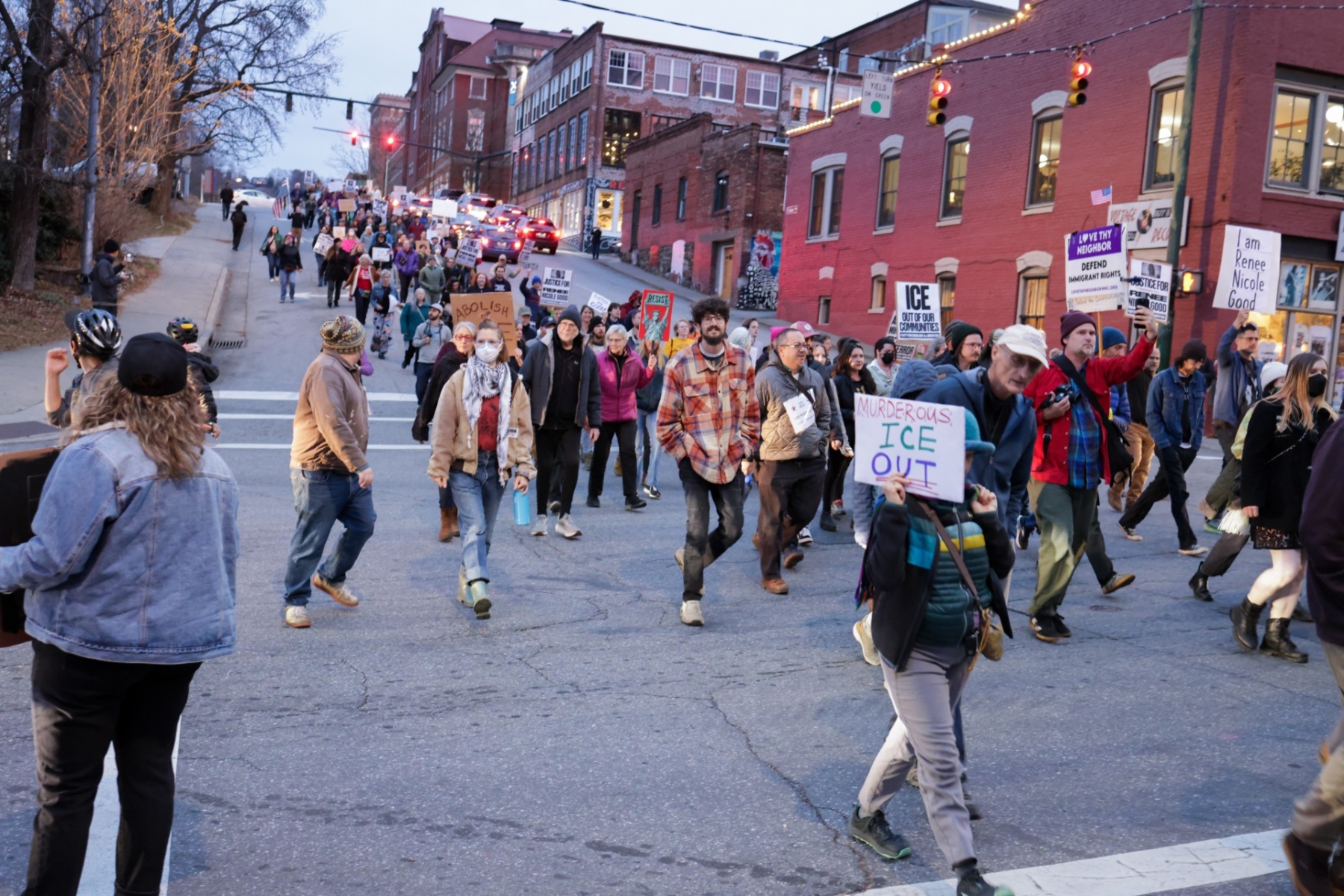 Protesters march through downtown Asheville, N.C., on Wednesday, Jan. 8, during a demonstration opposing U.S. Immigration and Customs Enforcement (ICE), following reports of a fatal shooting involving an ICE agent in Minneapolis. (Photo credit: James Burns)