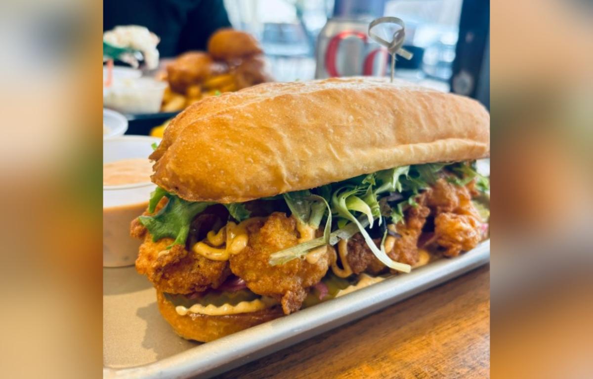 The Mother Ocean shrimp po’ boy -- a Cajun fried shrimp sandwich, slathered with remoulade, topped with shredded lettuce, sliced tomato and dill pickle chips served between two slices of toasted baguette -- was classic perfection.