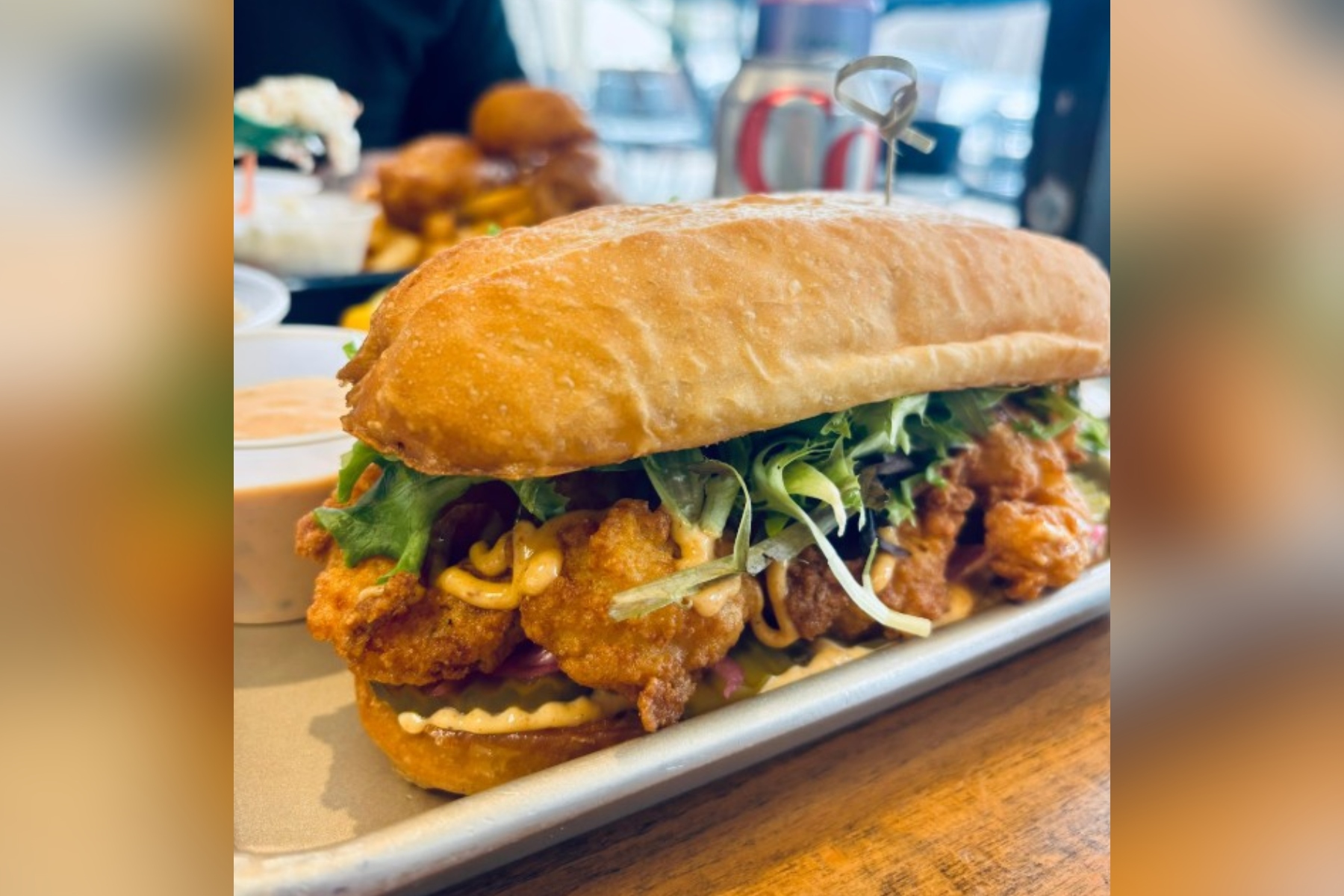 The Mother Ocean shrimp po’ boy -- a Cajun fried shrimp sandwich, slathered with remoulade, topped with shredded lettuce, sliced tomato and dill pickle chips served between two slices of toasted baguette -- was classic perfection.