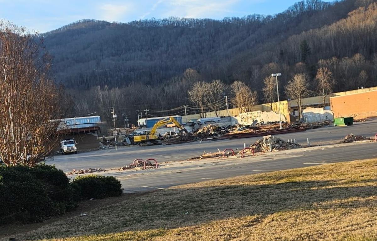 Demolition is underway at the former Ingles Markets site in Swannanoa, where damaged buildings are being torn down months after Tropical Storm Helene flooded the property and forced the grocery store’s permanent closure.