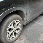 A drive around Asheville shows the toll recent storms have taken -- vehicles coated in salt and sand