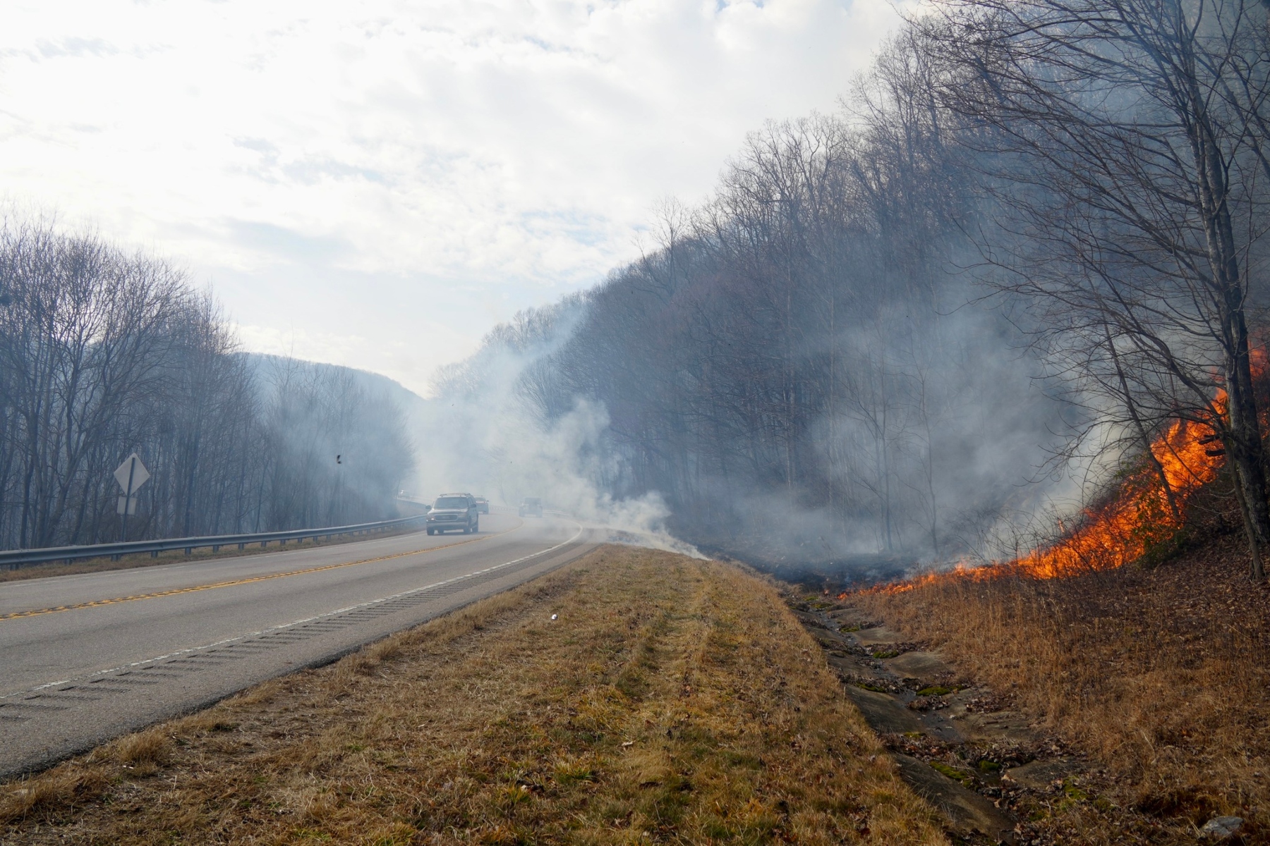The Winding Stairs Alpha Fire burns to the edge of the Highway 64 containment line. USDA Forest Service courtesy photo by Dana Hodde.