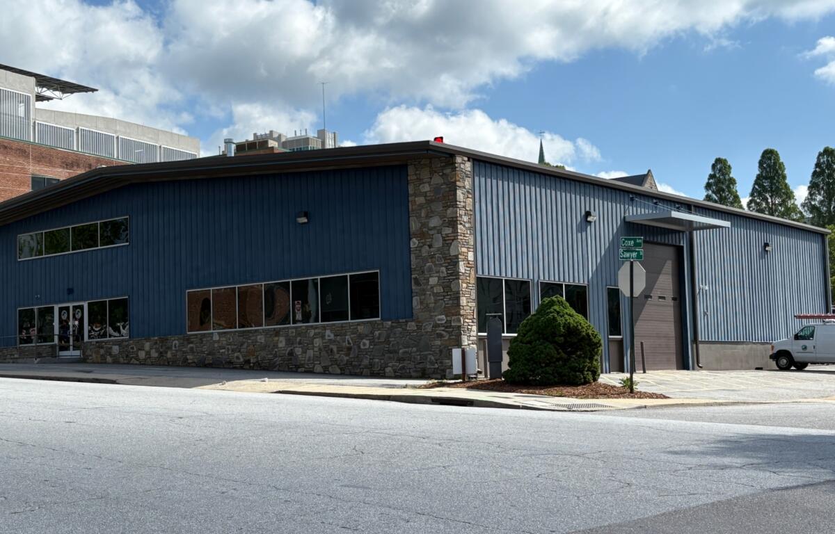 The Asheville City Council voted unanimously Tuesday to approve a zoning change for properties at 50 and 52 Coxe Ave., clearing the way for a 203-unit development on Buncombe County-owned land.