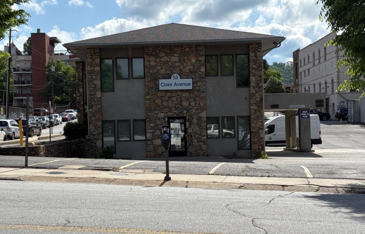 The Asheville City Council voted unanimously Tuesday to approve a zoning change for properties at 50 and 52 Coxe Ave., clearing the way for a 203-unit development on Buncombe County-owned land.
