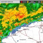NWS radar map showing a broad band of rainfall from green to red moving across western North Carolina and eastern Tennessee, with cities like Knoxville, Morristown, Asheville and Charlotte nearby.