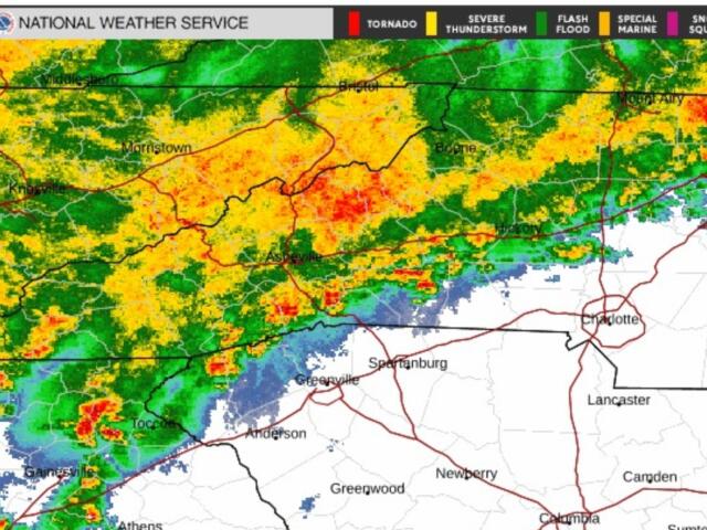 NWS radar map showing a broad band of rainfall from green to red moving across western North Carolina and eastern Tennessee, with cities like Knoxville, Morristown, Asheville and Charlotte nearby.
