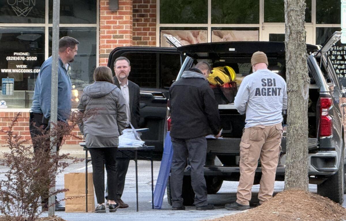 The North Carolina State Bureau of Investigation is at the scene of a shooting that left a suspect dead and an Asheville police officer injured.