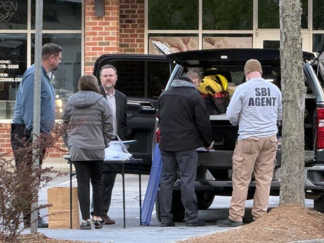 The North Carolina State Bureau of Investigation is at the scene of a shooting that left a suspect dead and an Asheville police officer injured.