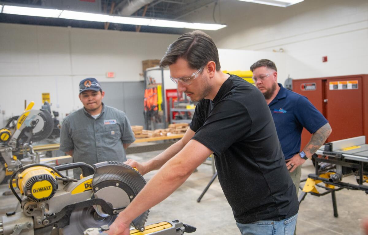 Andrew Lunceford, a recent Level Up: Core Construction graduate, operates a saw in Blue Ridge Community College's Spearman Building. (Photo credit: Blue Ridge Community College/Benjamin Rickert)