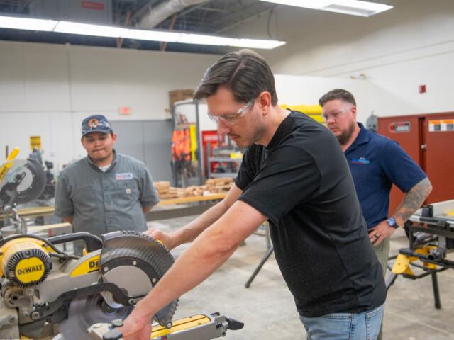 Andrew Lunceford, a recent Level Up: Core Construction graduate, operates a saw in Blue Ridge Community College's Spearman Building. (Photo credit: Blue Ridge Community College/Benjamin Rickert)