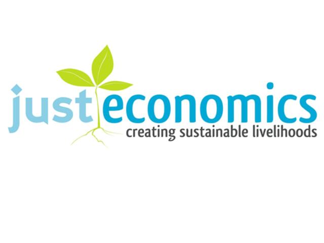 Just Economics logo featuring a green sprout and the tagline creating sustainable livelihoods.