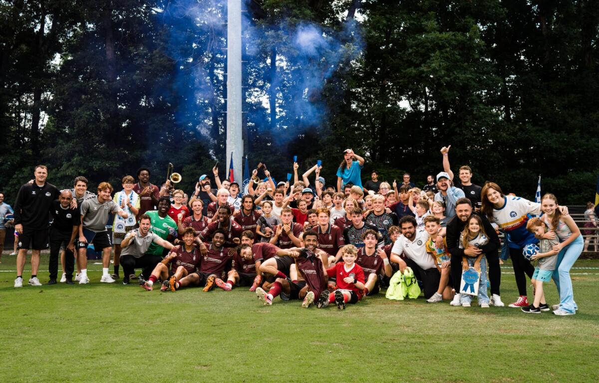 Asheville City Soccer Club celebrates after the Blues' 3-0 victory over Port City FC on Saturday at Greenwood Field.