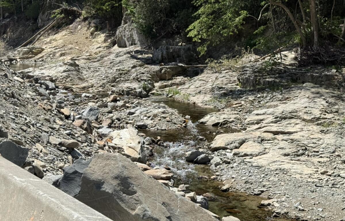 The Pigeon River flows through the gorge alongside Interstate 40 in Haywood County, where crews are rebuilding sections of the highway damaged by Tropical Storm Helene.