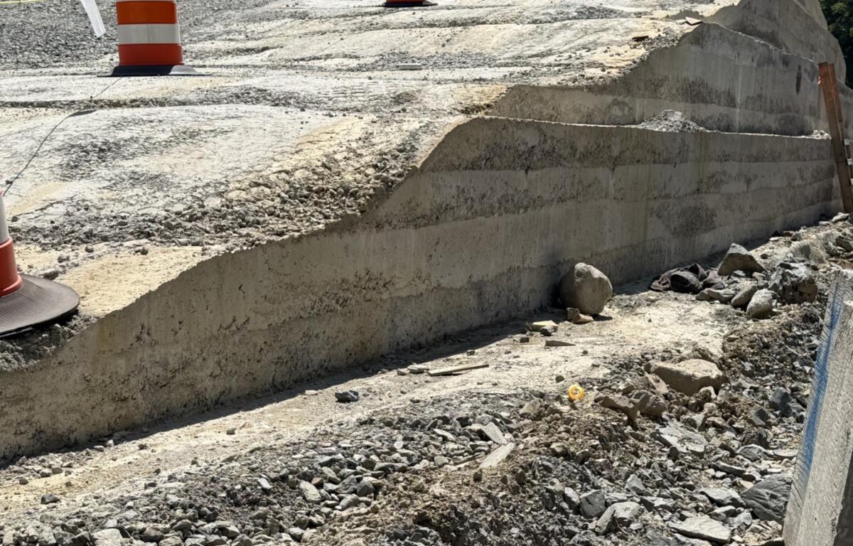 A section of roller-compacted concrete, or RCC, takes shape along Interstate 40 in the Pigeon River Gorge.