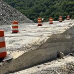 A section of roller-compacted concrete, or RCC, takes shape along Interstate 40 in the Pigeon River Gorge.