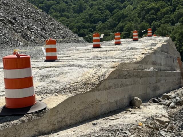 A section of roller-compacted concrete, or RCC, takes shape along Interstate 40 in the Pigeon River Gorge.