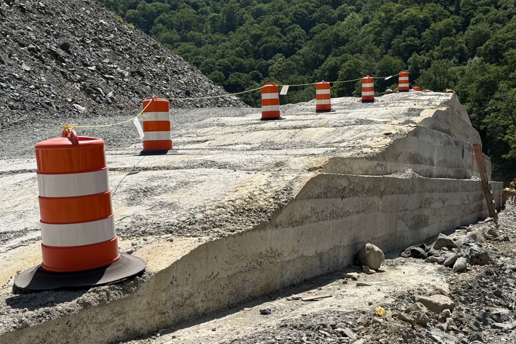 A section of roller-compacted concrete, or RCC, takes shape along Interstate 40 in the Pigeon River Gorge.