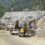 Traffic moves slowly above an active construction work zone on Interstate 40 near the Pigeon River Gorge, where holiday travel, ongoing repairs and reduced speeds can combine to create backups during peak periods.