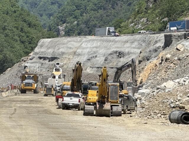 Traffic moves slowly above an active construction work zone on Interstate 40 near the Pigeon River Gorge, where holiday travel, ongoing repairs and reduced speeds can combine to create backups during peak periods.