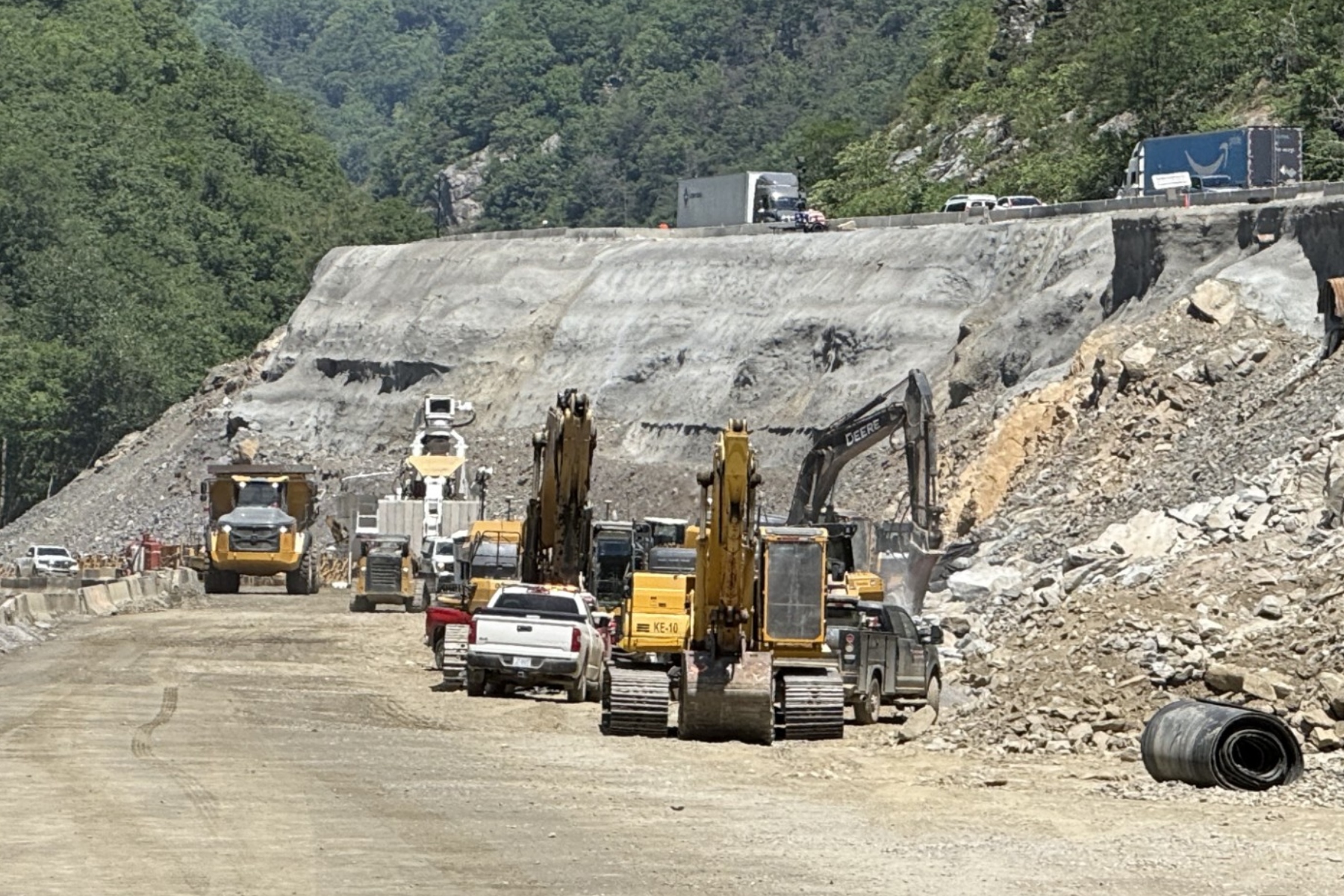 Traffic moves slowly above an active construction work zone on Interstate 40 near the Pigeon River Gorge, where holiday travel, ongoing repairs and reduced speeds can combine to create backups during peak periods.