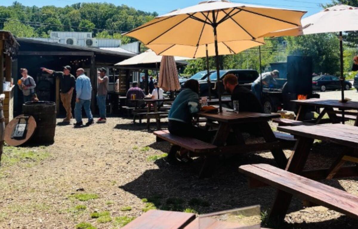 For barbecue fans in Asheville, the debate over who serves the best brisket can border on religion — and in Woodfin, Iron & Oak is making a serious case for the crown.
