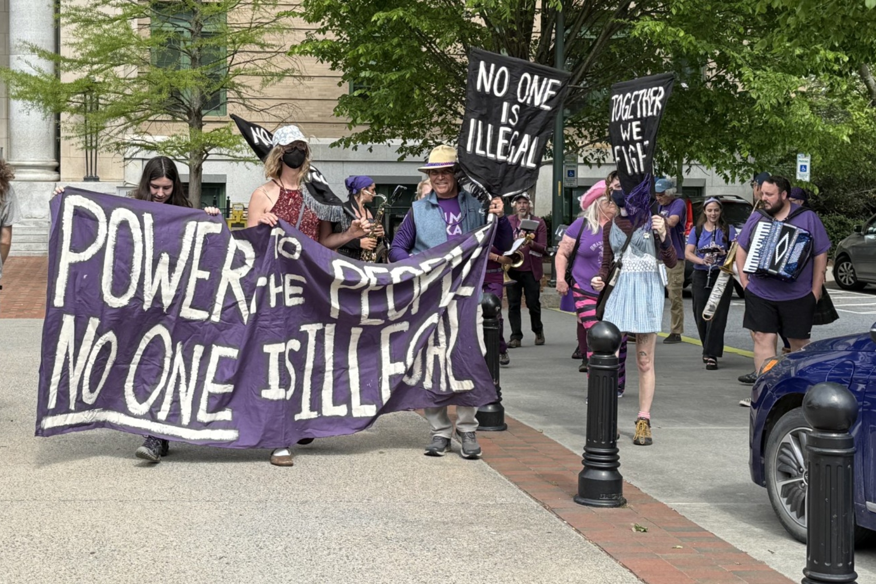 May Day protesters rally in downtown Asheville’s Pack Square Park ...