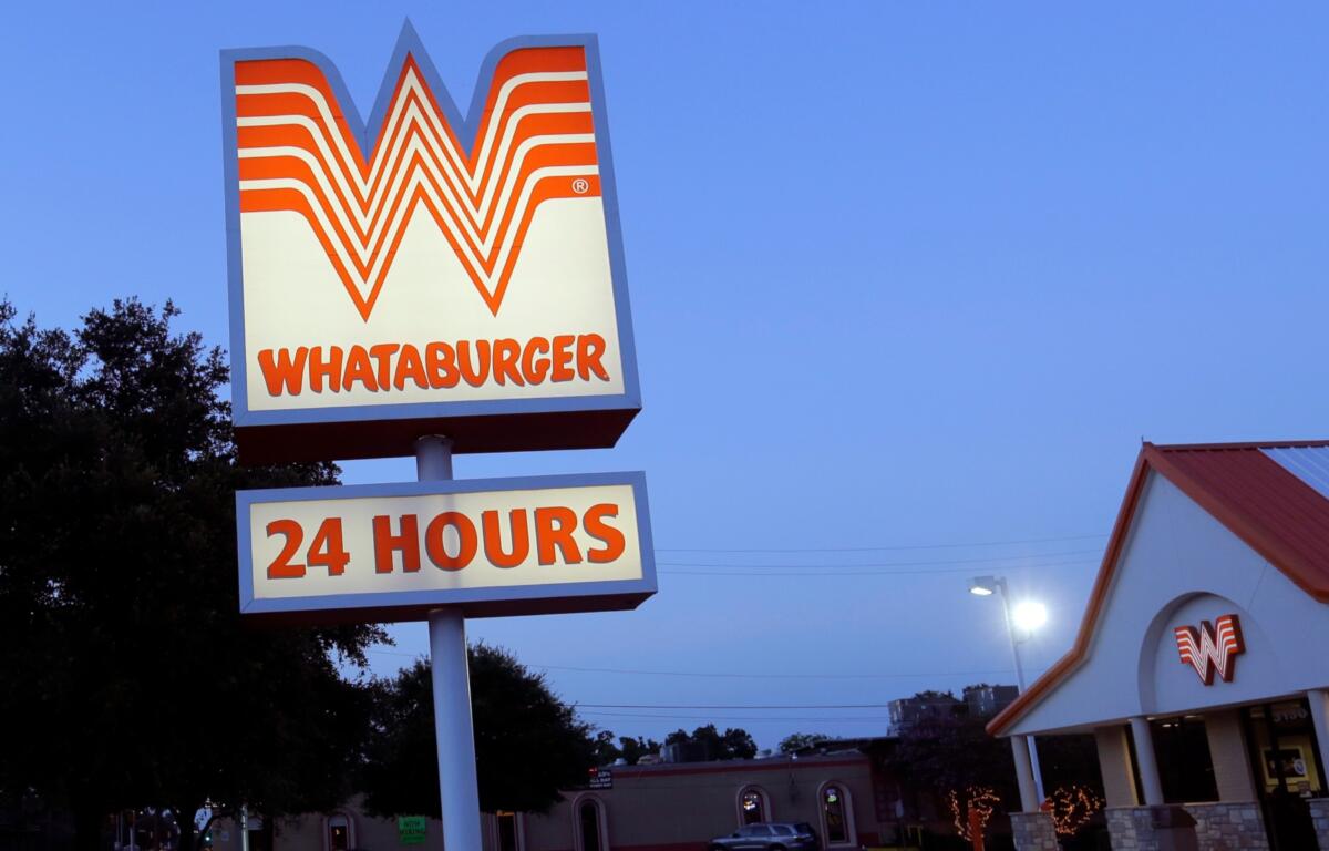 This Thursday, July 9, 2015 photo shows a Whataburger restaurant in San Antonio, Texas. The iconic Texas restaurant chain will not allow the open carrying of guns on its properties, taking a stand against a new law legalizing the practice. (AP Photo/Eric Gay)