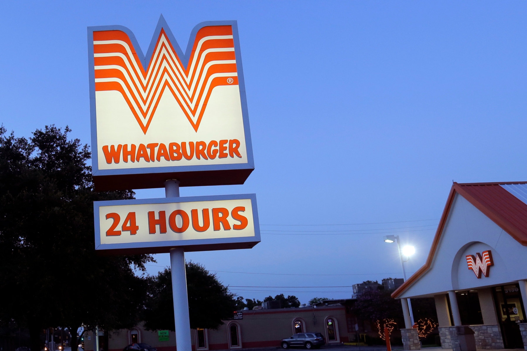 This Thursday, July 9, 2015 photo shows a Whataburger restaurant in San Antonio, Texas. The iconic Texas restaurant chain will not allow the open carrying of guns on its properties, taking a stand against a new law legalizing the practice. (AP Photo/Eric Gay)
