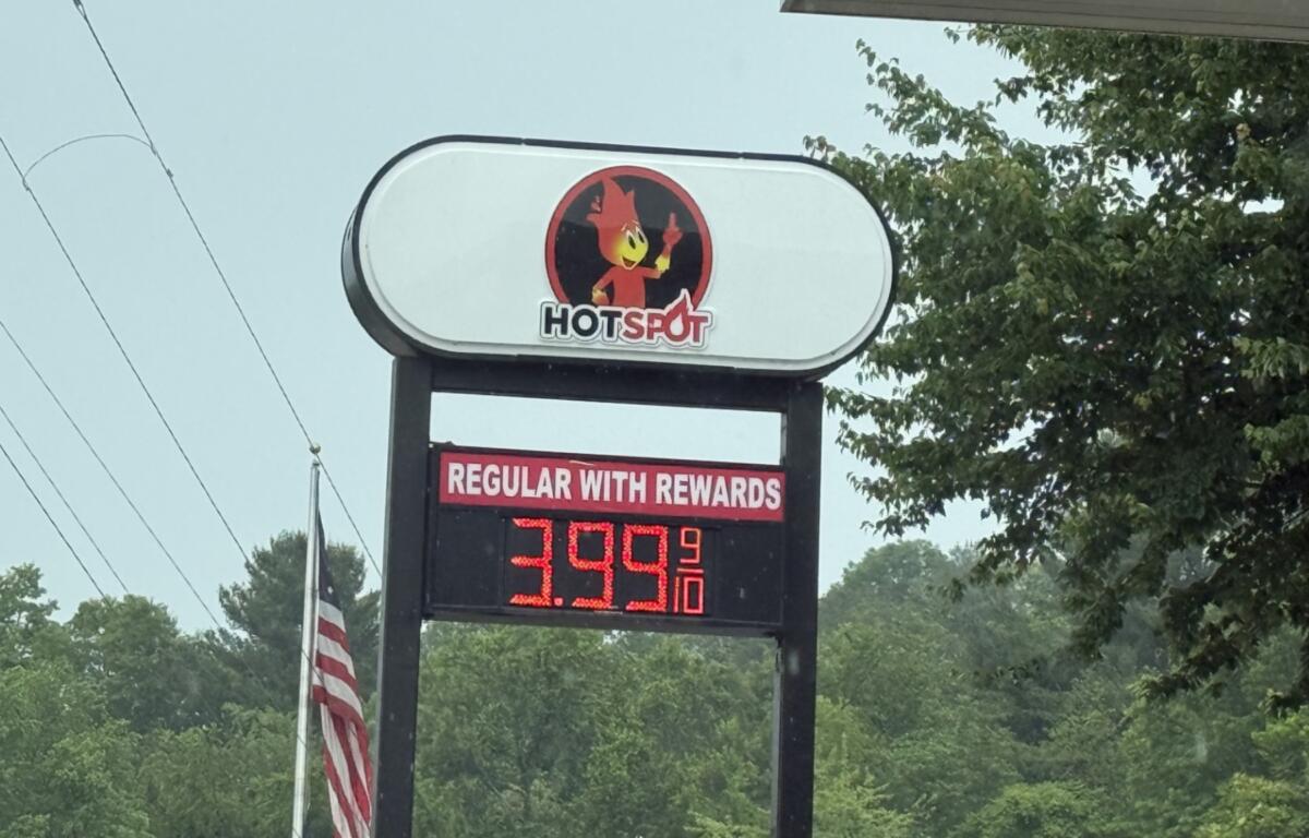 A driver fills up at a local gas station in Asheville as fuel prices remain above $4 a gallon, prompting many motorists to rely on rewards programs and price comparisons to save money at the pump.
