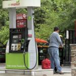 A driver fills up at a local gas station in Asheville as fuel prices remain above $4 a gallon, prompting many motorists to rely on rewards programs and price comparisons to save money at the pump.