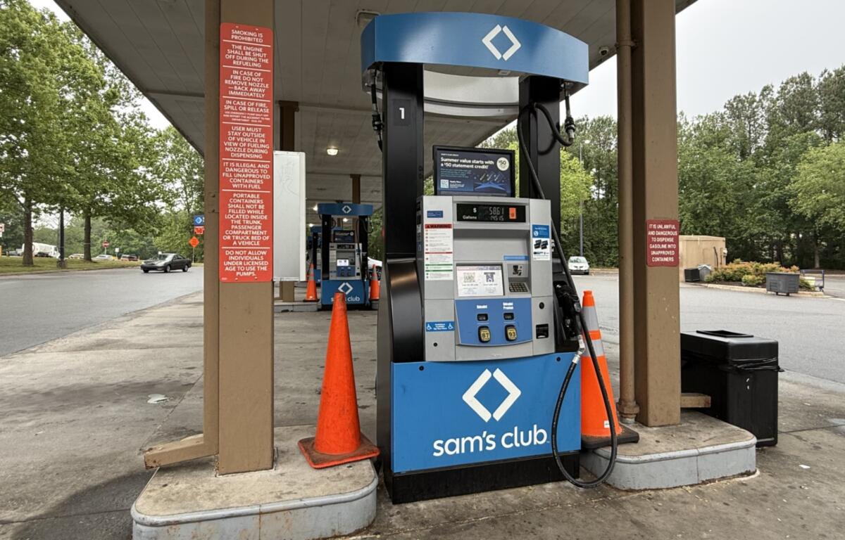 A driver fills up at a local gas station in Asheville as fuel prices remain above $4 a gallon, prompting many motorists to rely on rewards programs and price comparisons to save money at the pump.