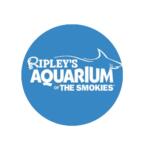 Ripley's Aquarium of the Smokies logo in a blue circle with white text and a shark outline.