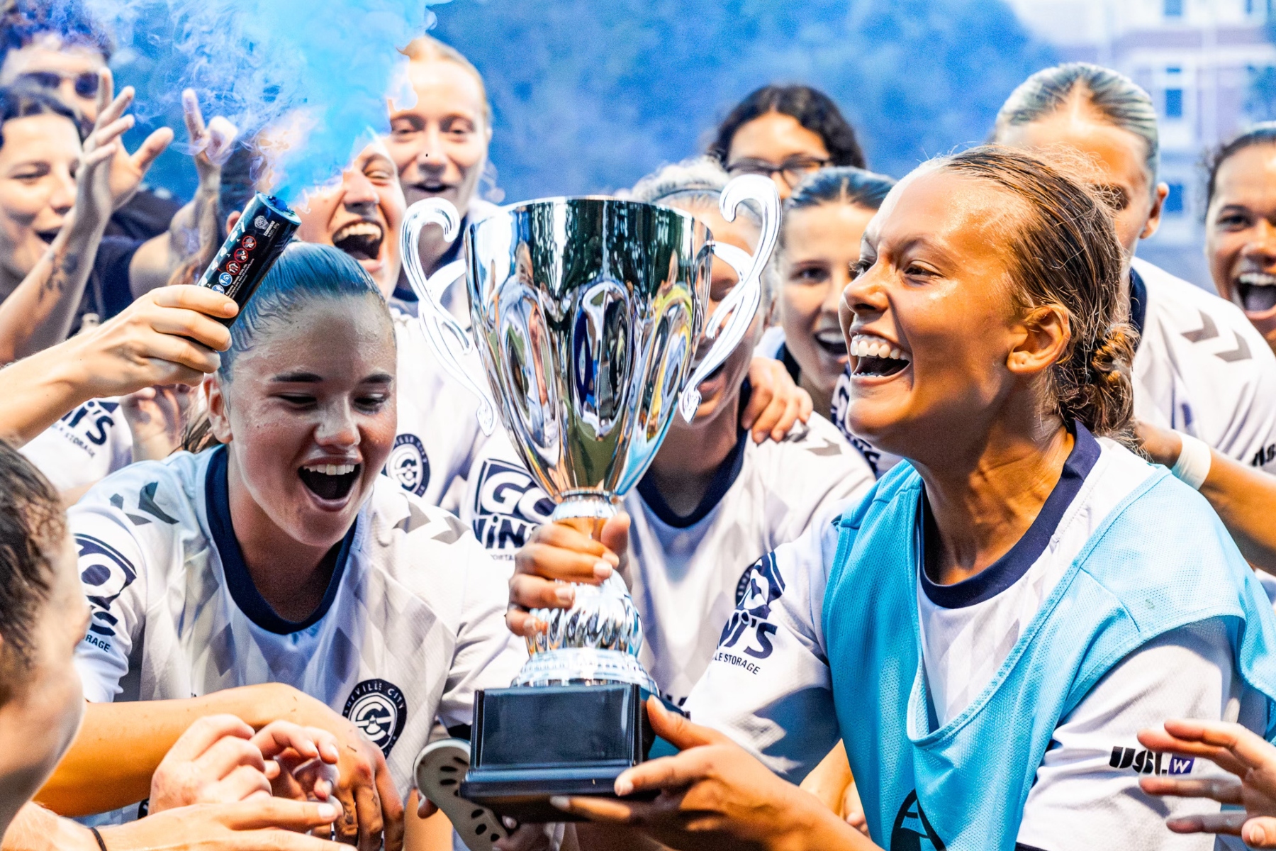 Asheville City SC players celebrate after clinching the South Central Division title with a 2-1 victory over Birmingham Legion WFC, earning a berth in the USL W League playoffs.