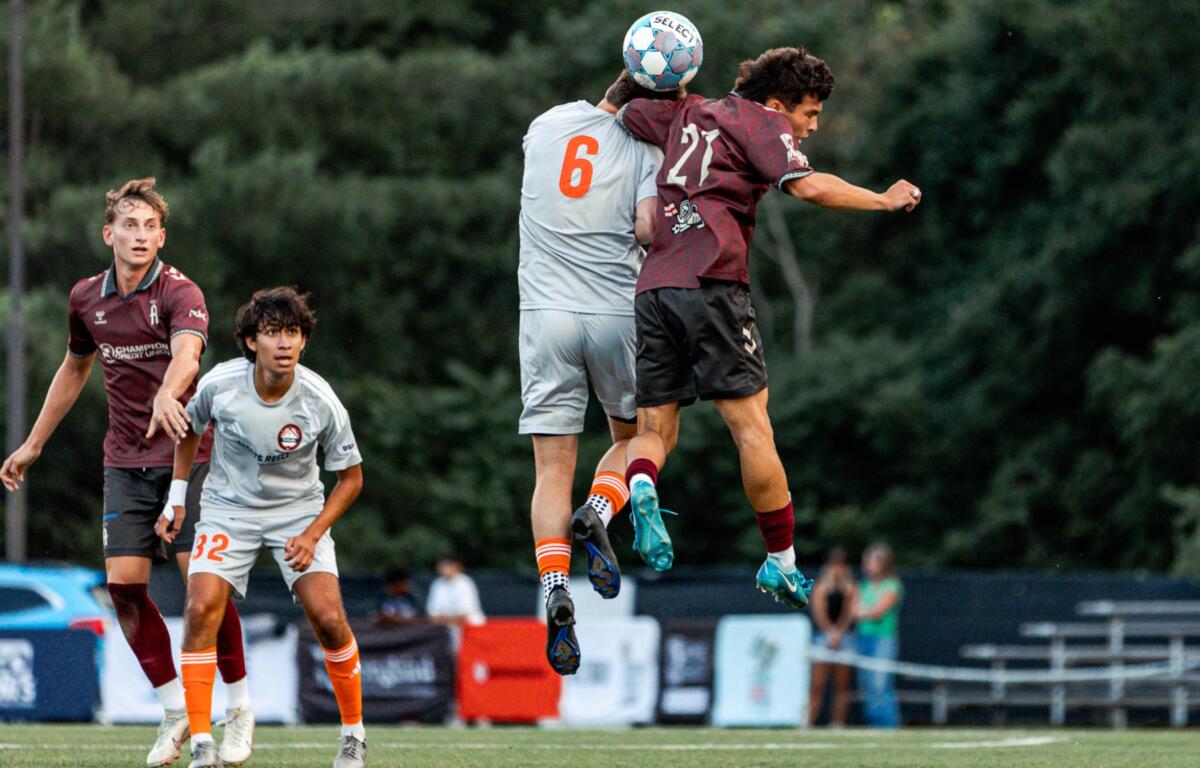 An Asheville City SC player battles for possession during the Blues' 2-0 victory over the Charlotte Eagles at Greenwood Field. (Photo credit: Becca Erzen/Asheville City Soccer Club)