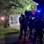 North Carolina SBI's Strategic Swat Unit surrounding the home in Asheville where the two inmates were located.