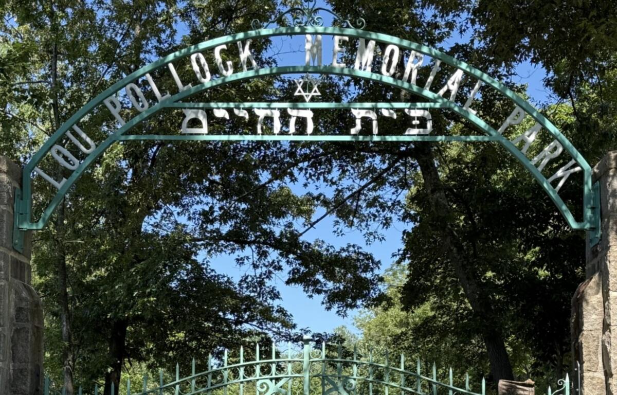 A sign marks the entrance to Lou Pollock Memorial Park, a historic Jewish cemetery founded in 1916 and renamed in honor of community leader Lou Pollock in 1949.