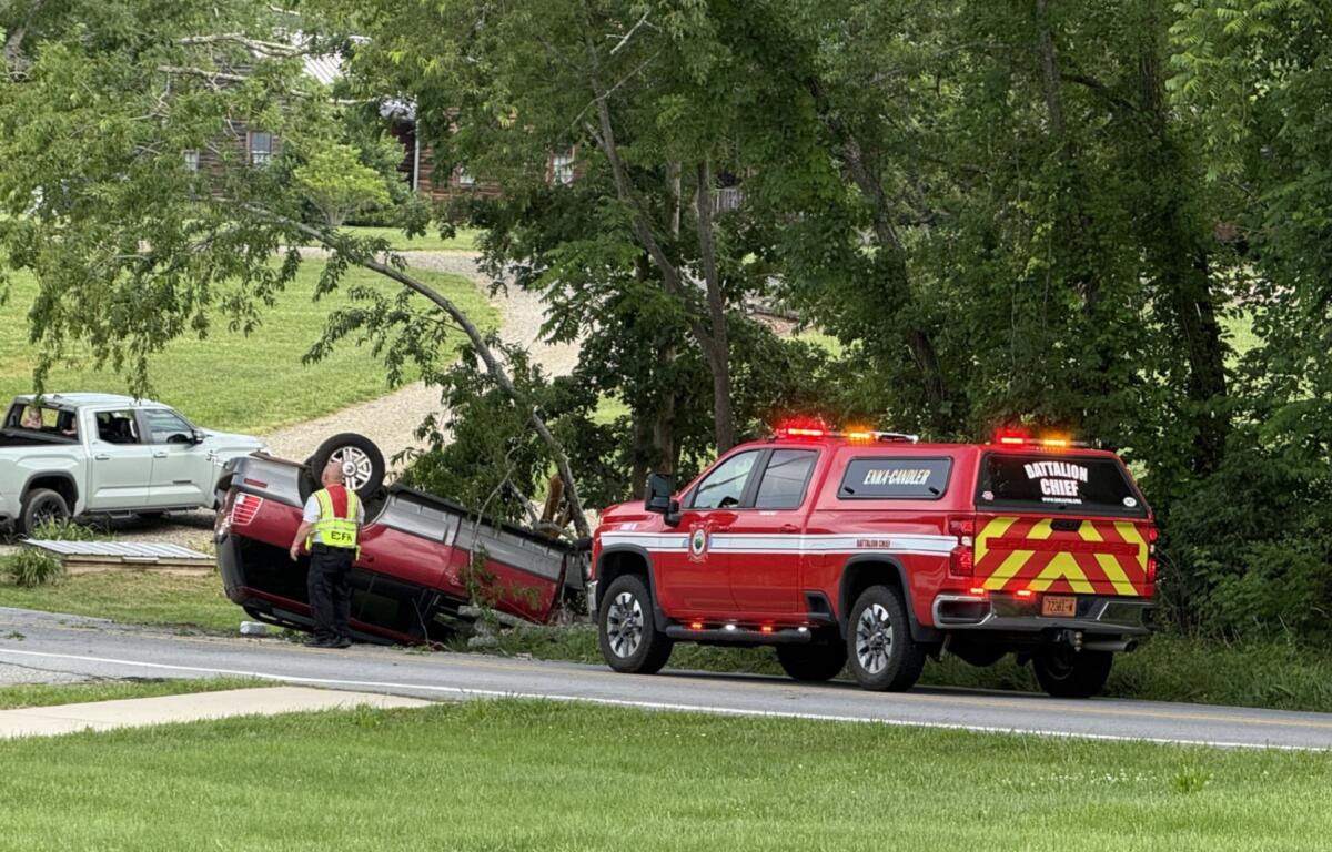 North Carolina State Highway Patrol troopers and emergency responders work the scene of a single-vehicle crash on Monte Vista Road in Candler on Sunday morning.