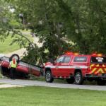 North Carolina State Highway Patrol troopers and emergency responders work the scene of a single-vehicle crash on Monte Vista Road in Candler on Sunday morning.