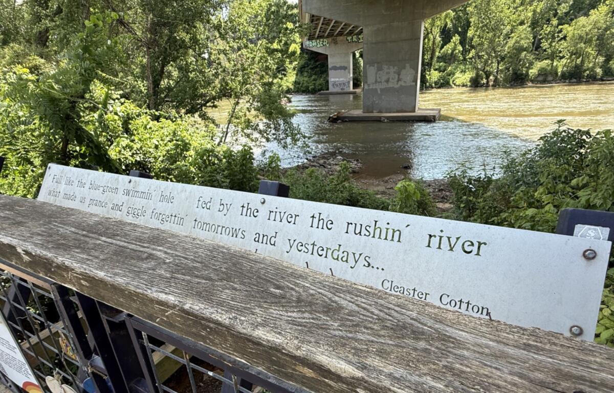 The French Broad River flowing through Asheville's River Arts District.