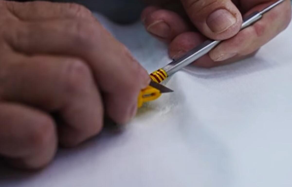 Colored tape that has long been used to identify medical instruments is being removed as the Charles George Department of Veterans Affairs Medical Center transitions to laser-etched markings. (Photo credit: Charles George Department of Veterans Affairs Medical Center)