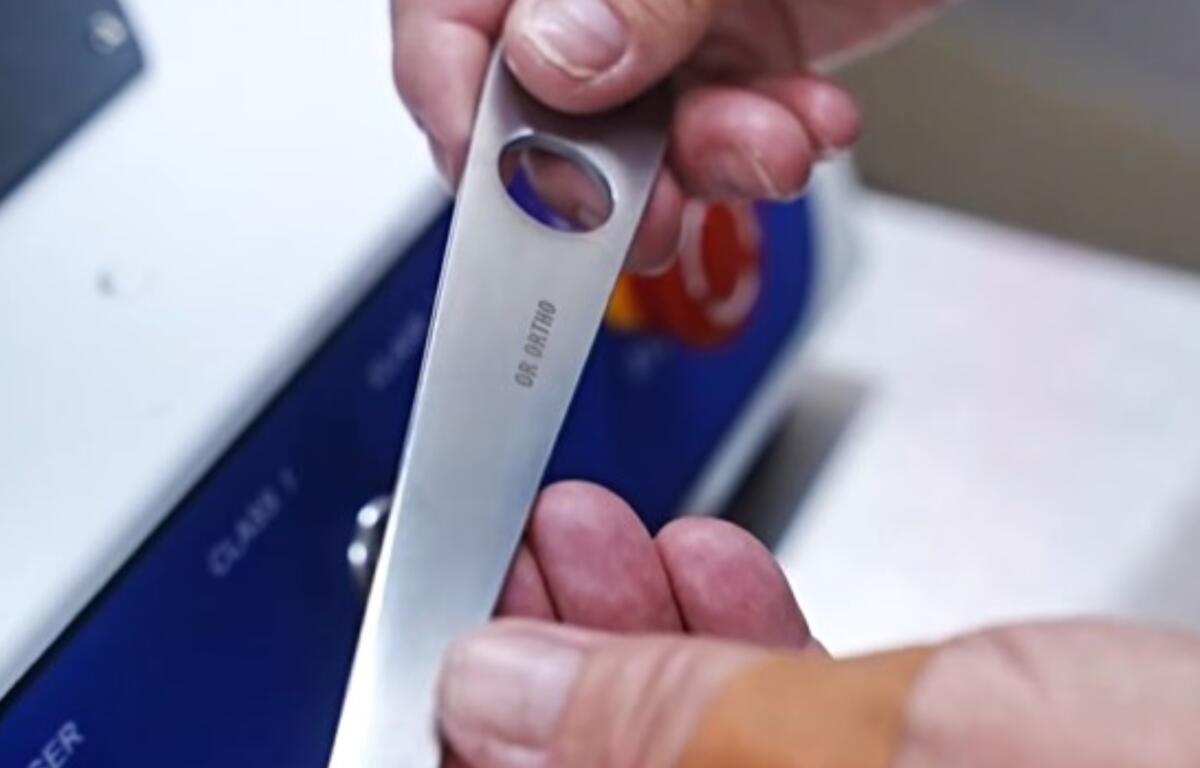 A laser-etched surgical instrument displays a permanent department identifier and QR code at the Charles George Department of Veterans Affairs Medical Center in Asheville. (Photo credit: Charles George Department of Veterans Affairs Medical Center)