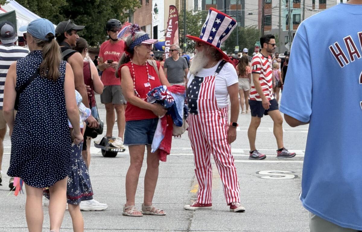 People gather in Asheville's South Slope on Saturday, July 4, 2026, to celebrate Independence Day