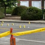 Asheville police officers and forensic investigators process the scene of a deadly shooting along Biltmore Avenue and Short Coxe Avenue early Sunday morning.