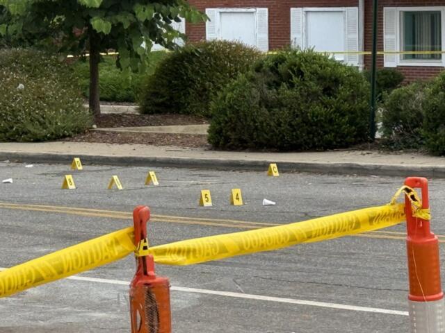 Asheville police officers and forensic investigators process the scene of a deadly shooting along Biltmore Avenue and Short Coxe Avenue early Sunday morning.