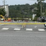 Asheville police officers and forensic investigators process the scene of a deadly shooting along Biltmore Avenue and Short Coxe Avenue early Sunday morning.