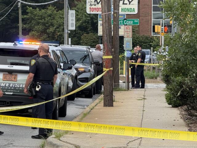 Asheville police officers and forensic investigators process the scene of a deadly shooting along Biltmore Avenue and Short Coxe Avenue early Sunday morning.