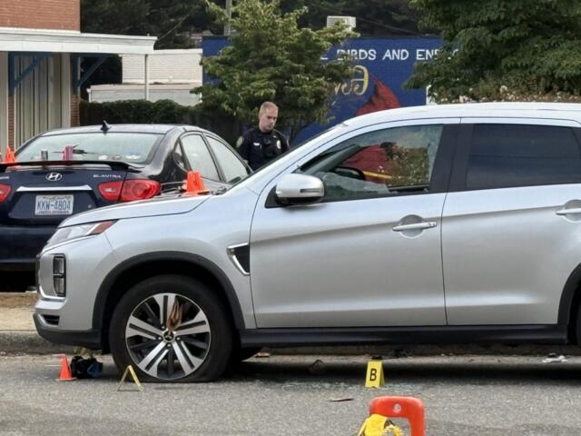 Asheville police officers and forensic investigators process the scene of a deadly shooting along Biltmore Avenue and Short Coxe Avenue early Sunday morning.